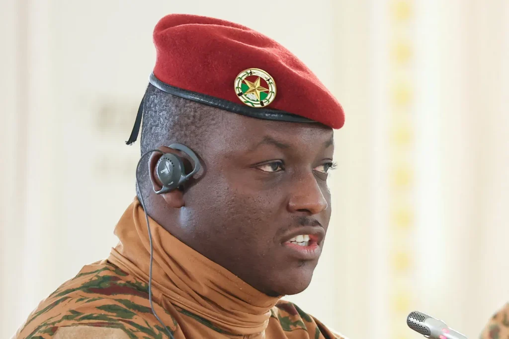 A man in military uniform wearing a red beret