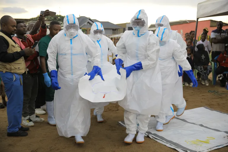Health workers wearing protective suits